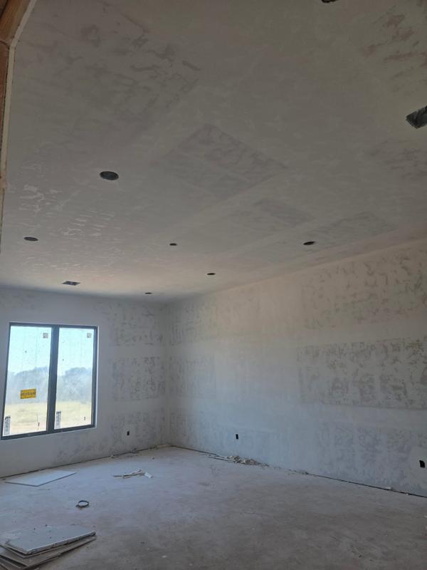Drywall finished around new windows on a new build